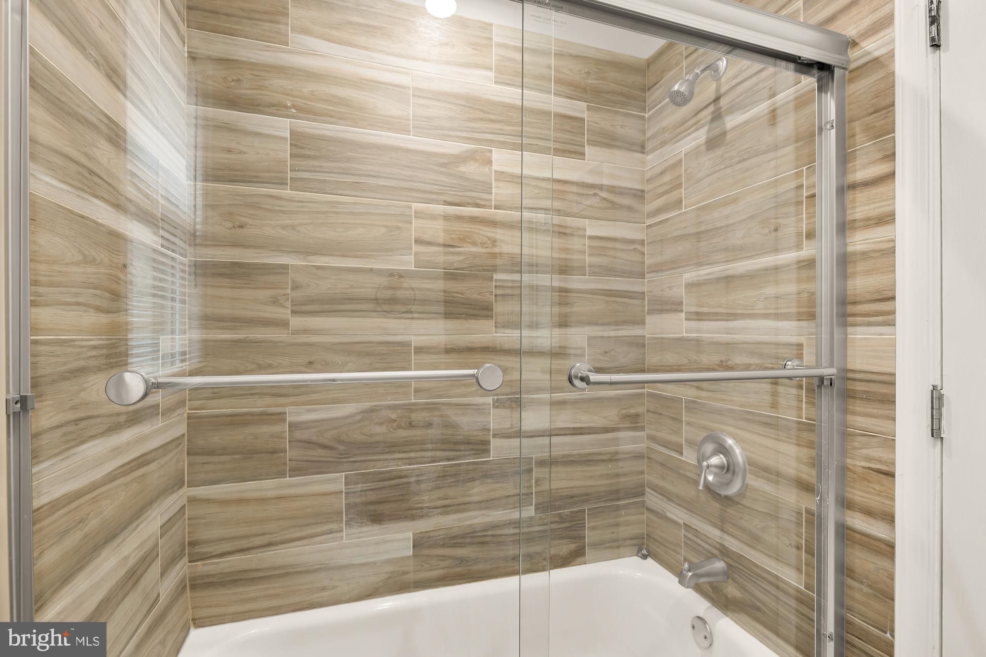 4131 Hunt Place Northeast, Unit A Washington, DC 20019 - Photo 6 of 9 a bathroom with a shower