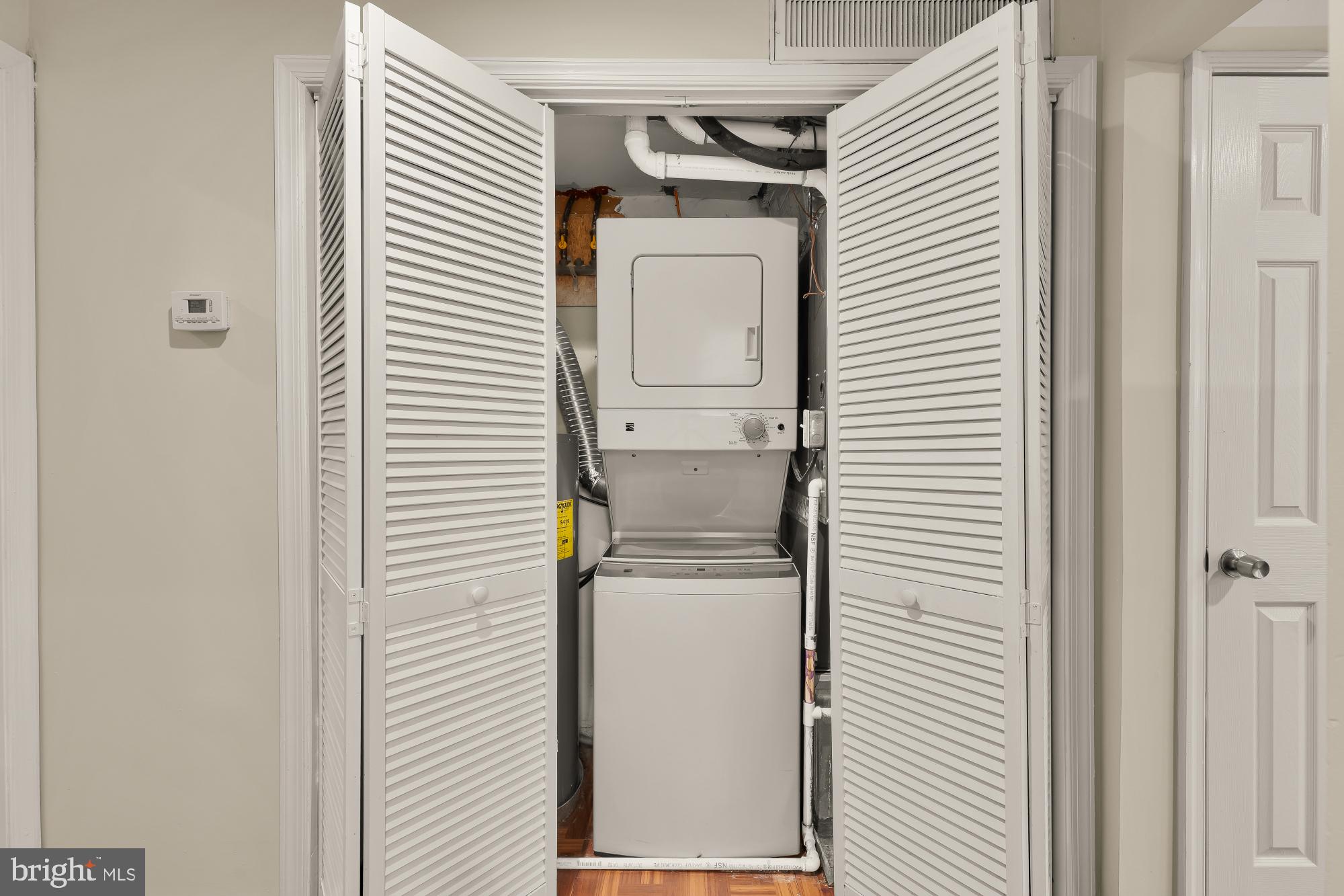 4131 Hunt Place Northeast, Unit A Washington, DC 20019 - Photo 7 of 9 a utility room with closet dryer and washer