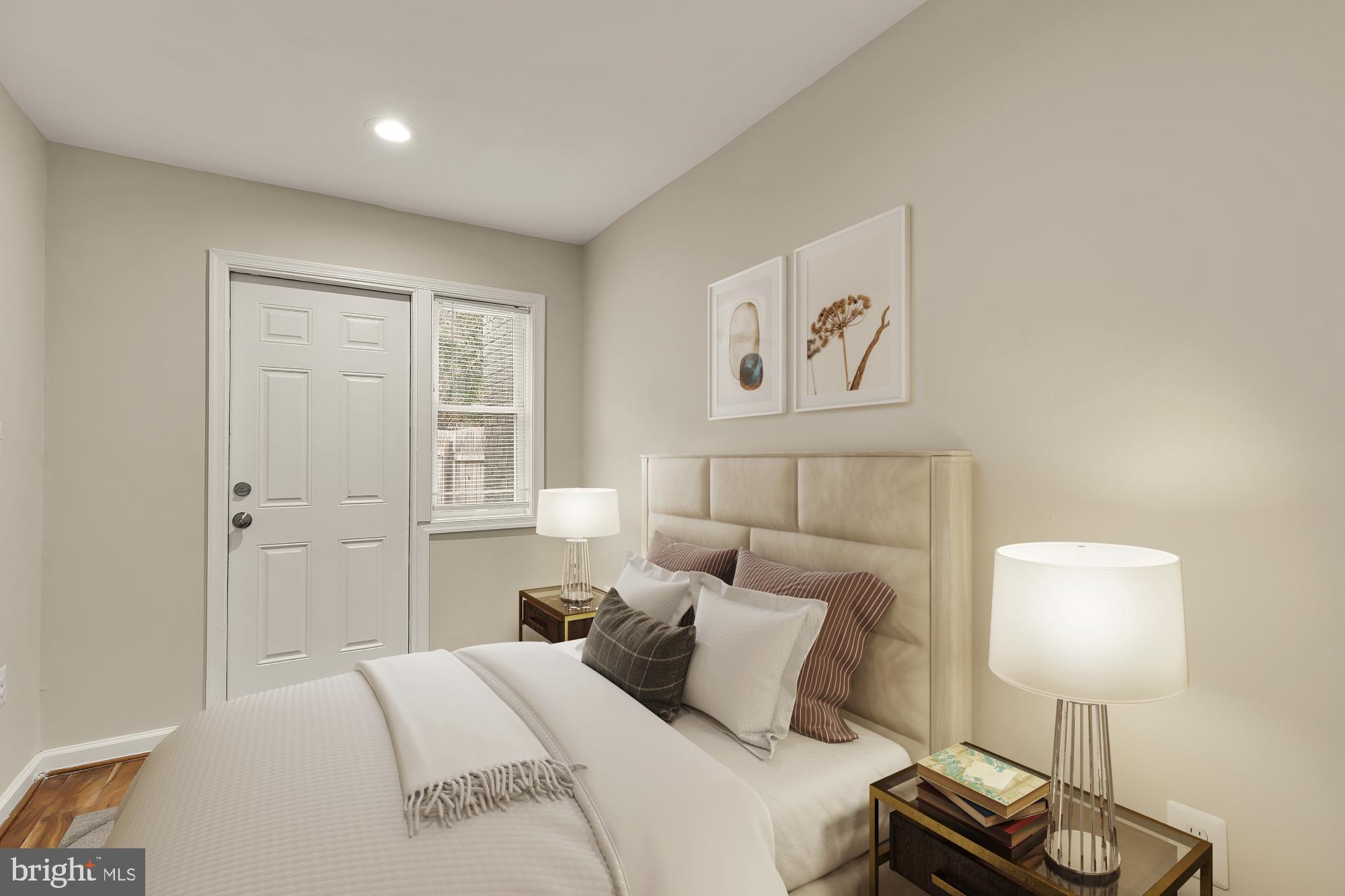 4131 Hunt Place Northeast, Unit A Washington, DC 20019 - Photo 8 of 9 a bedroom with a bed and a lamp