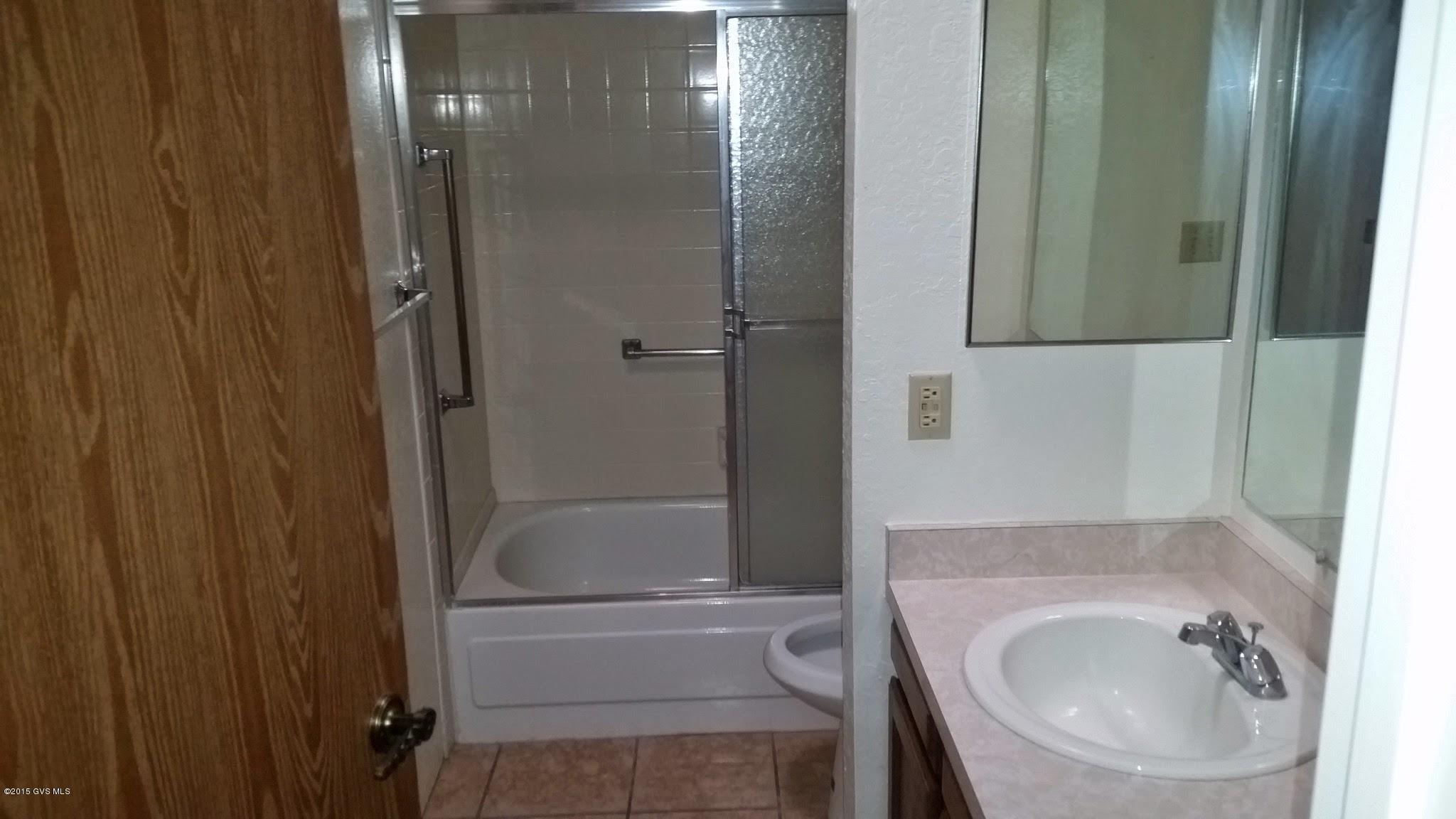 622 West Rio San Pedro Green Valley, AZ 85614 - Photo 9 of 16 a bathroom with a sink and a mirror