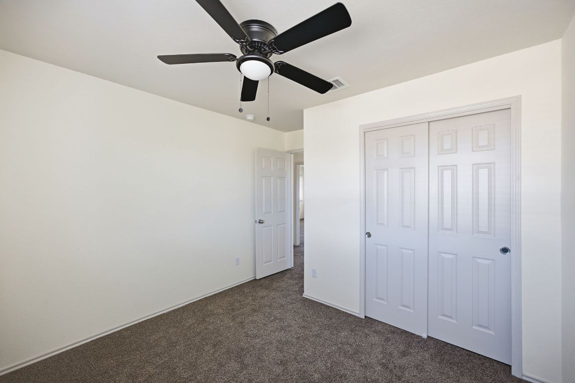 408 Azurite Drive Jarrell, TX 76537 - Photo 19 of 34 an empty room with closet area