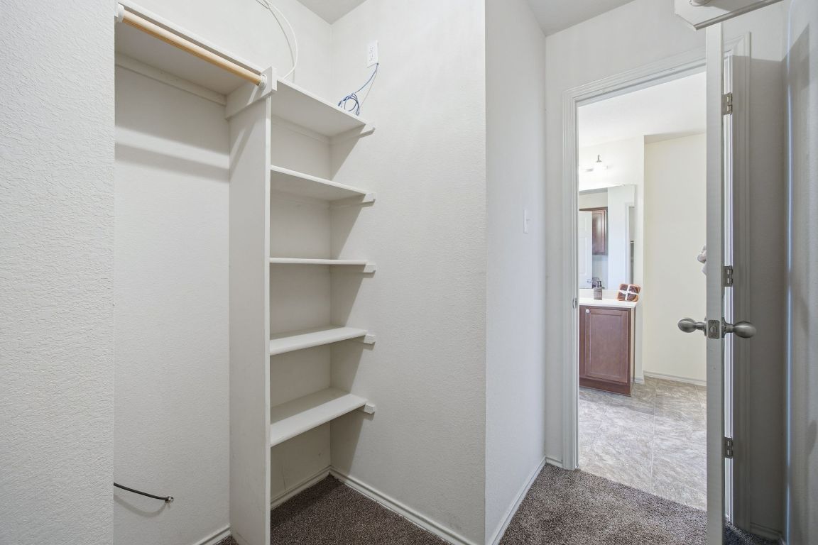 408 Azurite Drive Jarrell, TX 76537 - Photo 25 of 34 a view of an empty walk in closet