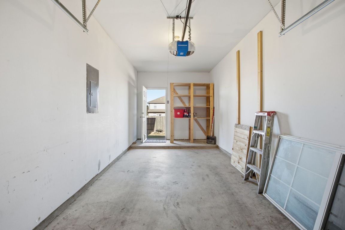 408 Azurite Drive Jarrell, TX 76537 - Photo 33 of 34 a view of a hallway with a chandelier