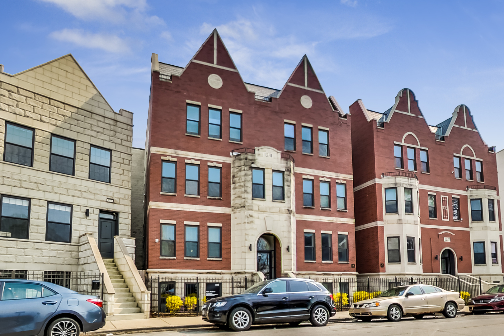 1231 East 46th Street, Unit GE Chicago, IL 60653 - Photo 1 of 16 a front view of a building with lot of cars and trees