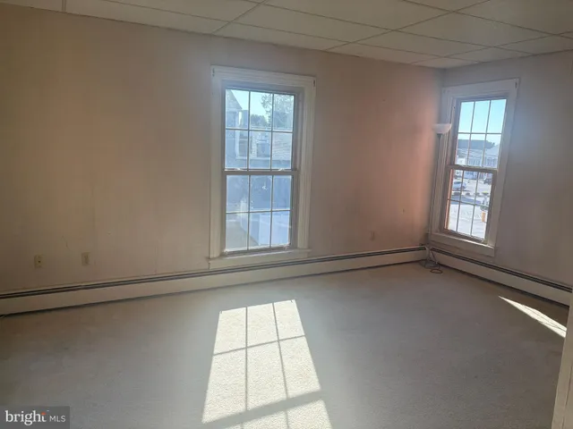 an empty room with windows