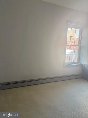 wooden floor in an empty room and a window