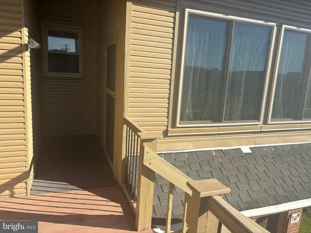 a view of a door and a window