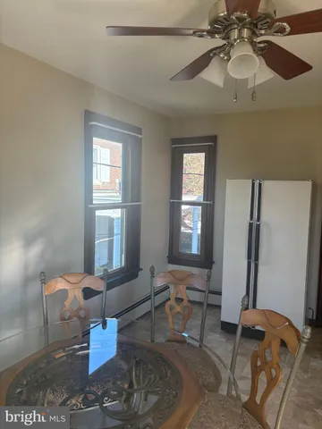 a living room with furniture a window and a chandelier