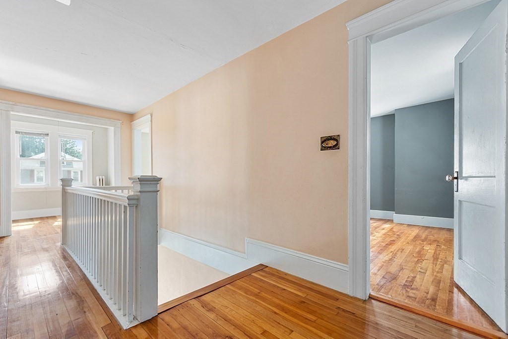 27 Woodman Road Worcester, MA 01602 - Photo 12 of 27 a view of hallway with kitchen and wooden floor