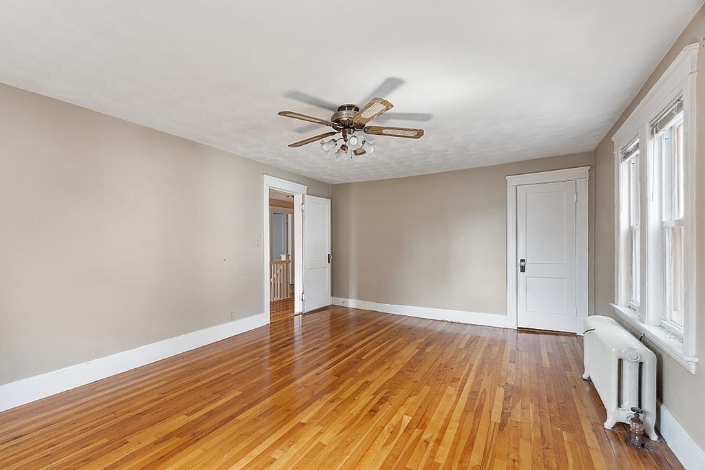 27 Woodman Road Worcester, MA 01602 - Photo 17 of 27 wooden floor in an empty room with a window