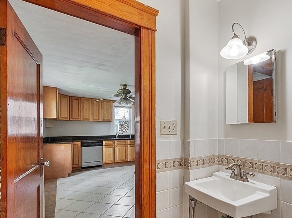 27 Woodman Road Worcester, MA 01602 - Photo 20 of 27 a bathroom with a sink and a mirror