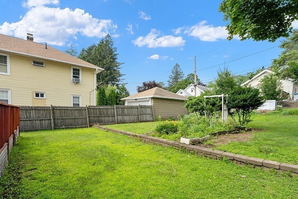 27 Woodman Road Worcester, MA 01602 - Photo 27 of 27 a view of a backyard with a garden
