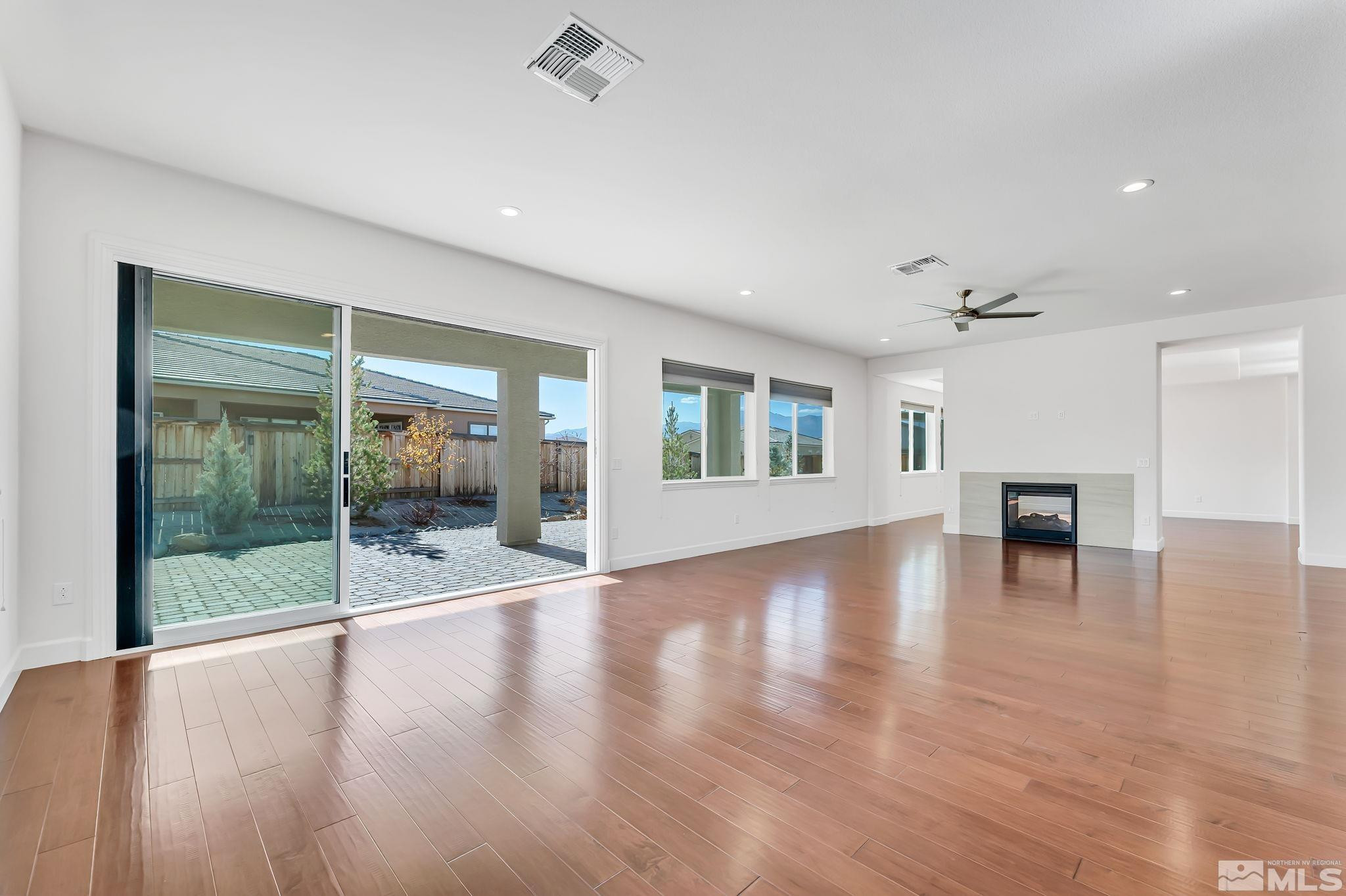 2902 Miramis Court Reno, NV 89521 - Photo 8 of 39 a view of a livingroom with furniture wooden floor and window