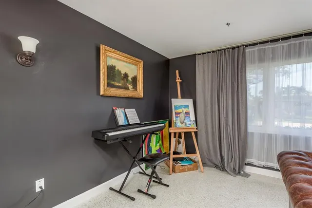 a view of a dining room with furniture and window