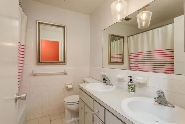 a view of a room with wooden floor and a cabinet