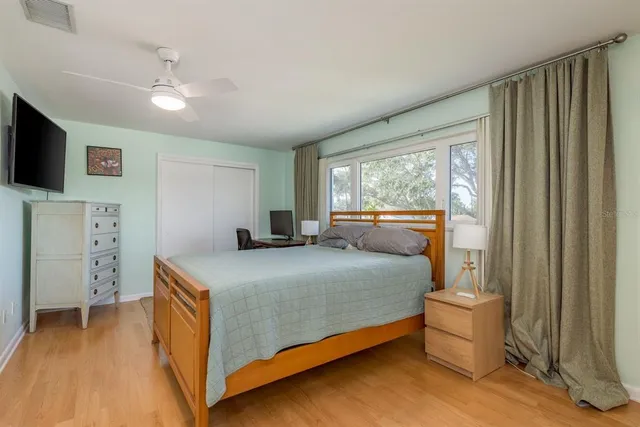 a bedroom with a bed and window