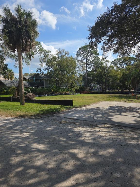 417 Tennessee Avenue Crystal Beach, FL 34683 - Photo 4 of 5 a view of a yard in front of a house