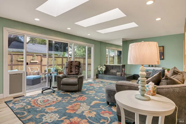 a living room with furniture and a rug
