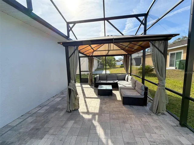 a lobby with furniture and a chandelier