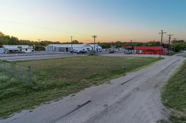 an aerial view of a house with big yard