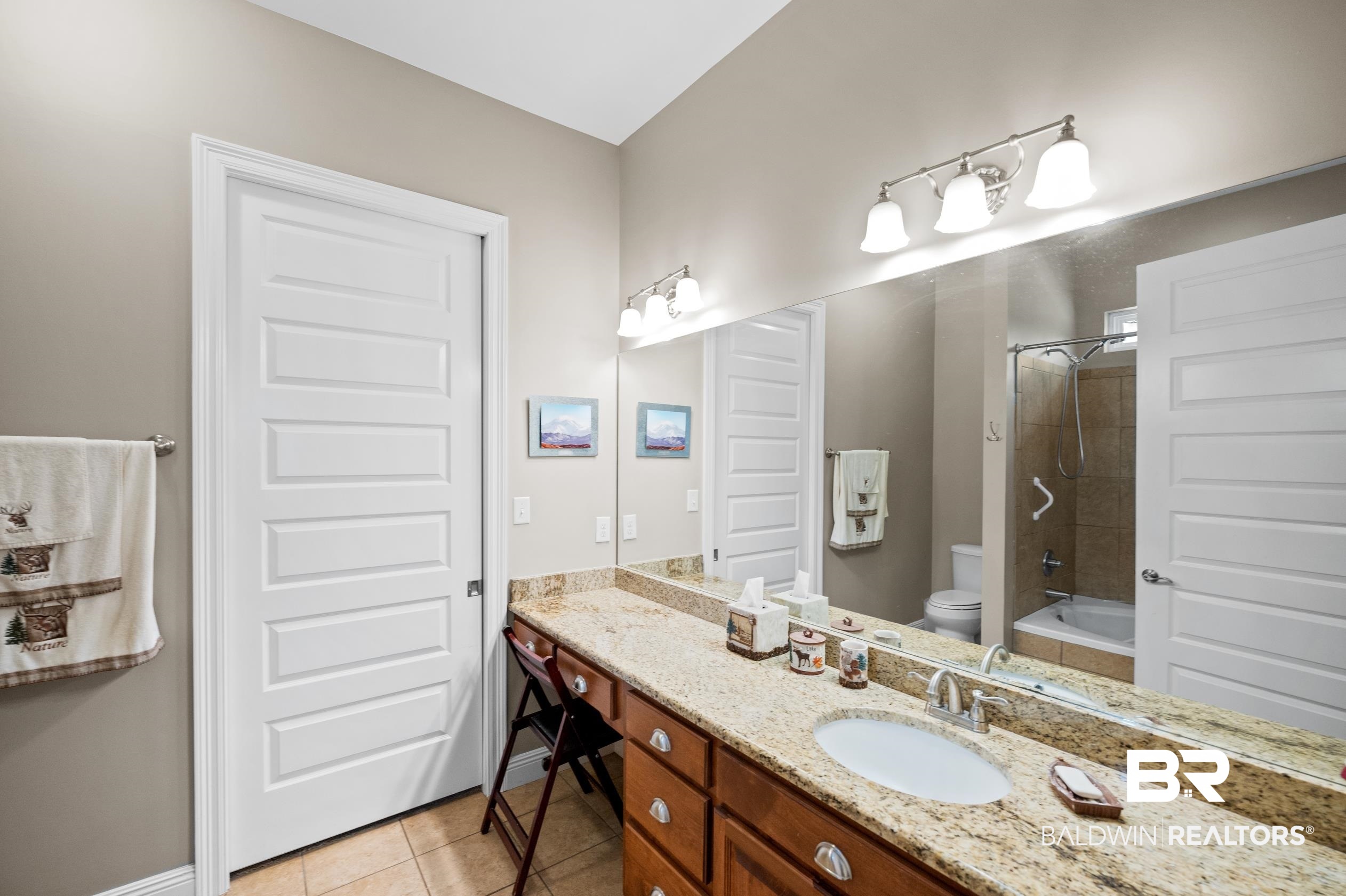 9060 Bromley Road Bay Minette, AL 36507 - Photo 39 of 63 Bathroom with vanity, tile patterned flooring, and shower / washtub combination