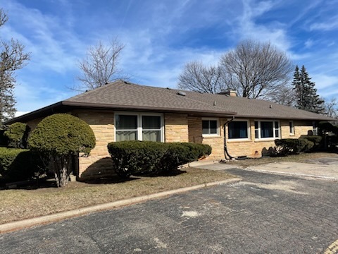 13N055 Coombs Road Elgin, IL 60124 - Photo 28 of 34 a front view of a house with a garden
