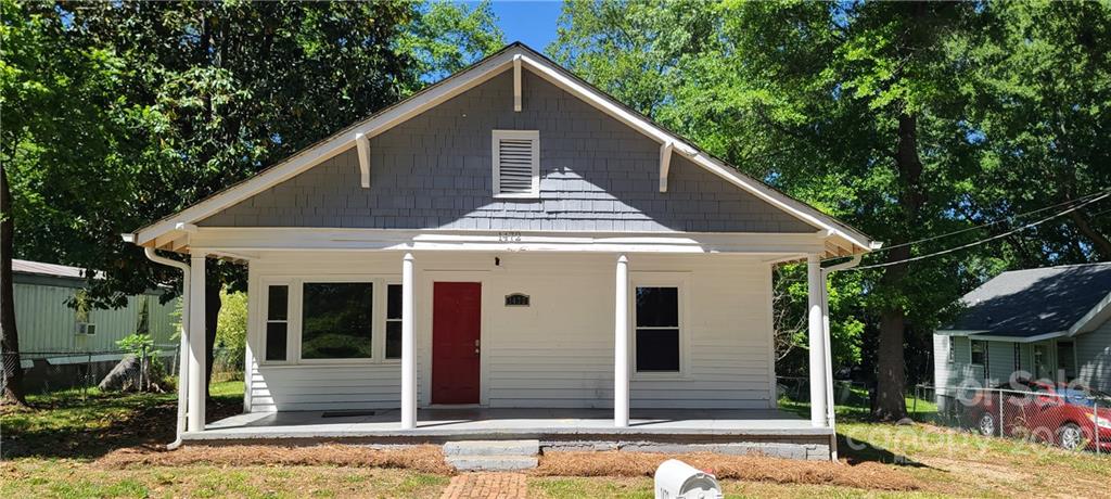1472 Rhodes Rhyne Road Lincolnton, NC 28092 - Photo 3 of 42 a front view of a house with a porch