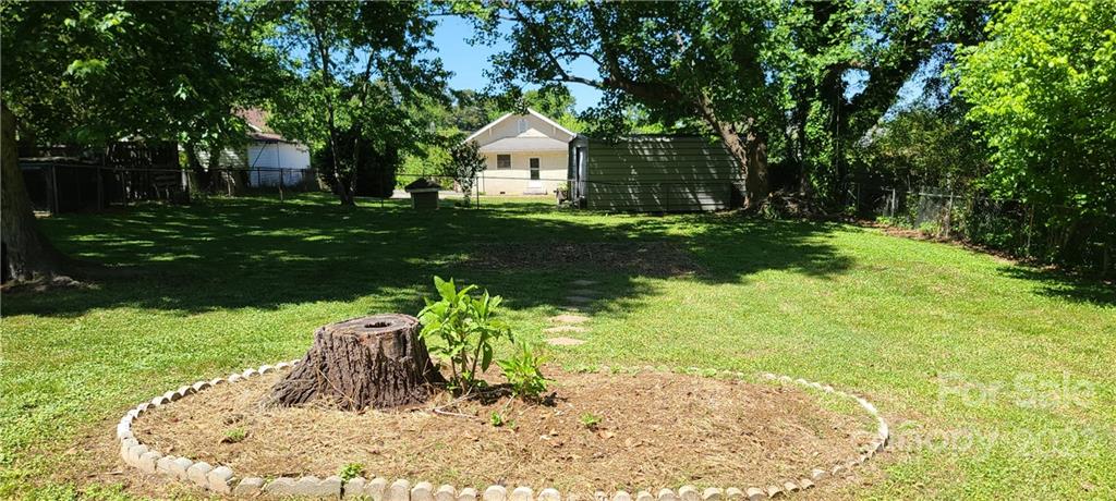 1472 Rhodes Rhyne Road Lincolnton, NC 28092 - Photo 8 of 42 a front view of a house with a yard