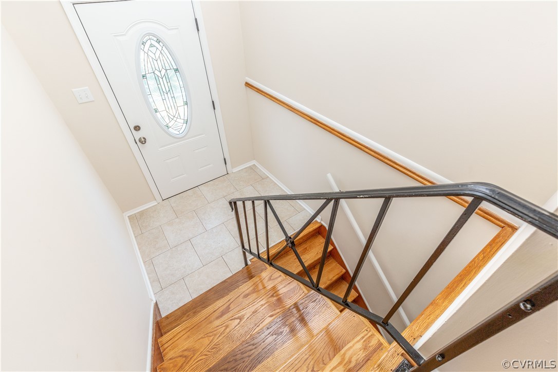 Tile landing and wood stair case. Brand new decora
