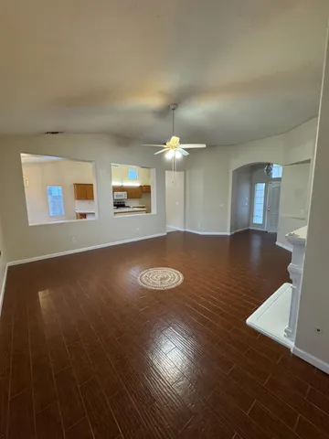 a view of a livingroom with wooden floor