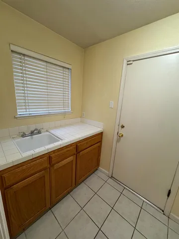 a bathroom with a sink and a shower