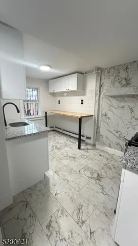 a room with a sink and a stove