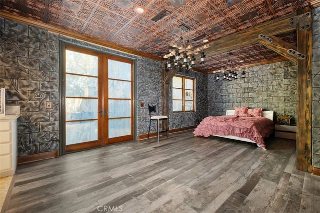 a kitchen with stainless steel appliances granite countertop a sink a stove a microwave and a refrigerator