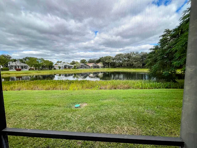 a view of a lake with a big yard