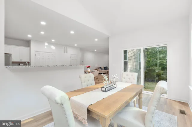 a spacious bedroom with a bed and a couch