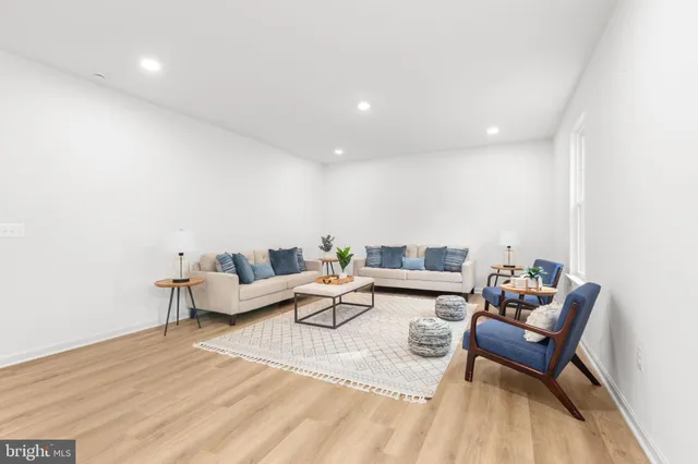 a spacious bedroom with a bed and a large window