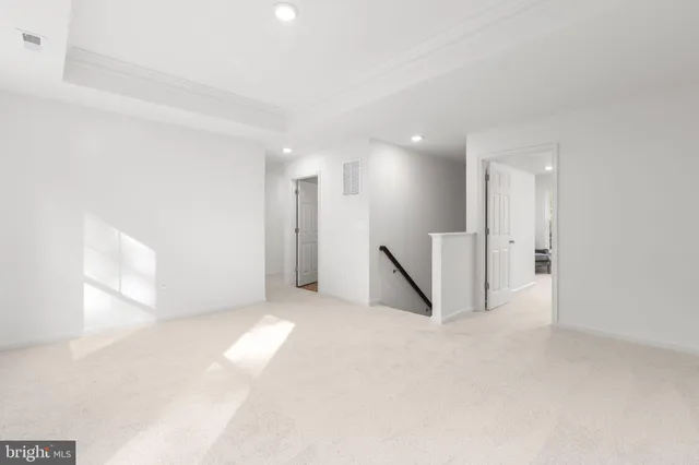 a bedroom with a bed and a night stand