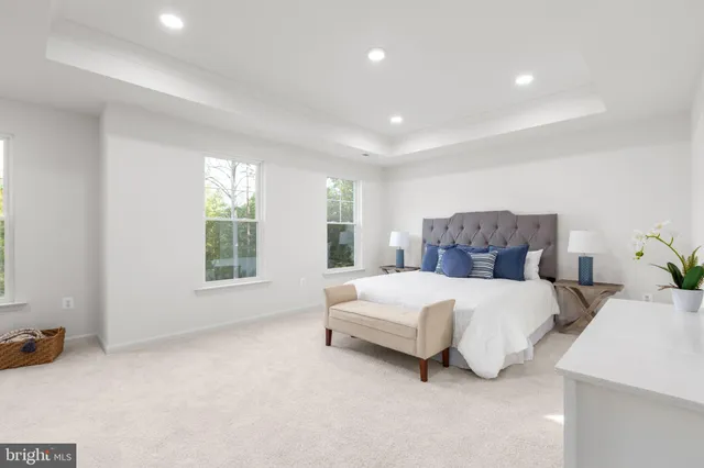 a bedroom with a bed and a night stand