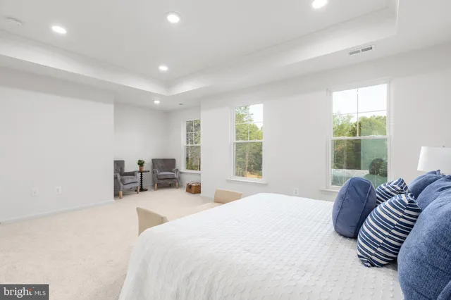 a bathroom with a double vanity sink toilet and a mirror