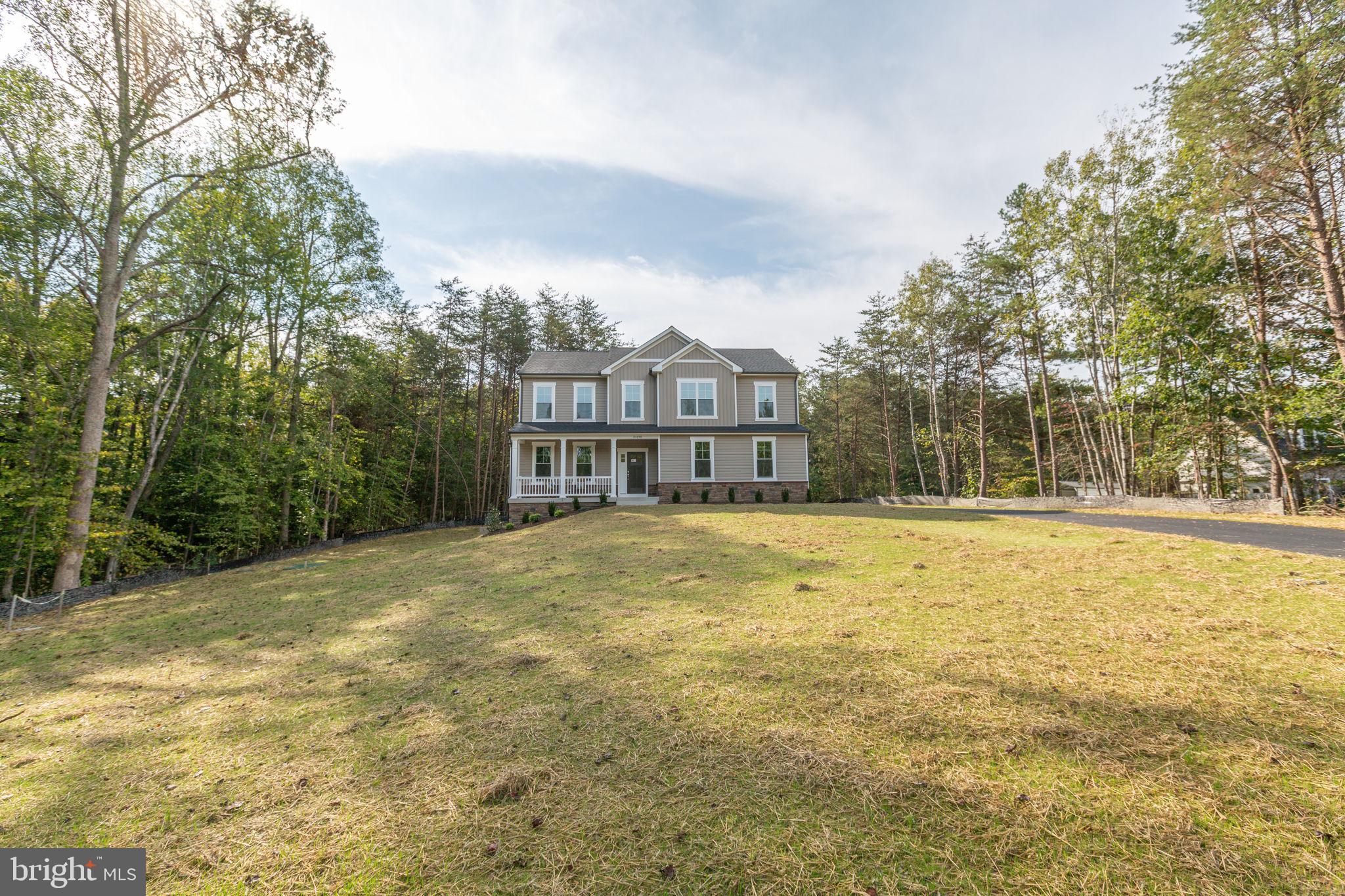 34198 Enchanted Way Locust Grove, VA 22508 - Photo 2 of 62 a view of a large pool with an outdoor space and seating area