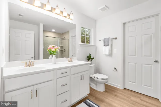 a view of a work space with furniture and wooden floor
