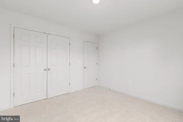 a view of a room with closet and wooden floor