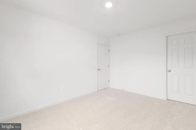 a view of a room with wooden walls