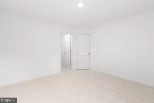 a view of an empty room with a stairs