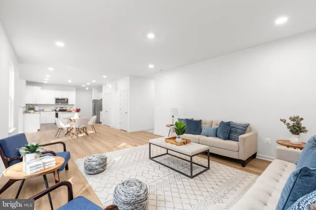 a living room with furniture and a table