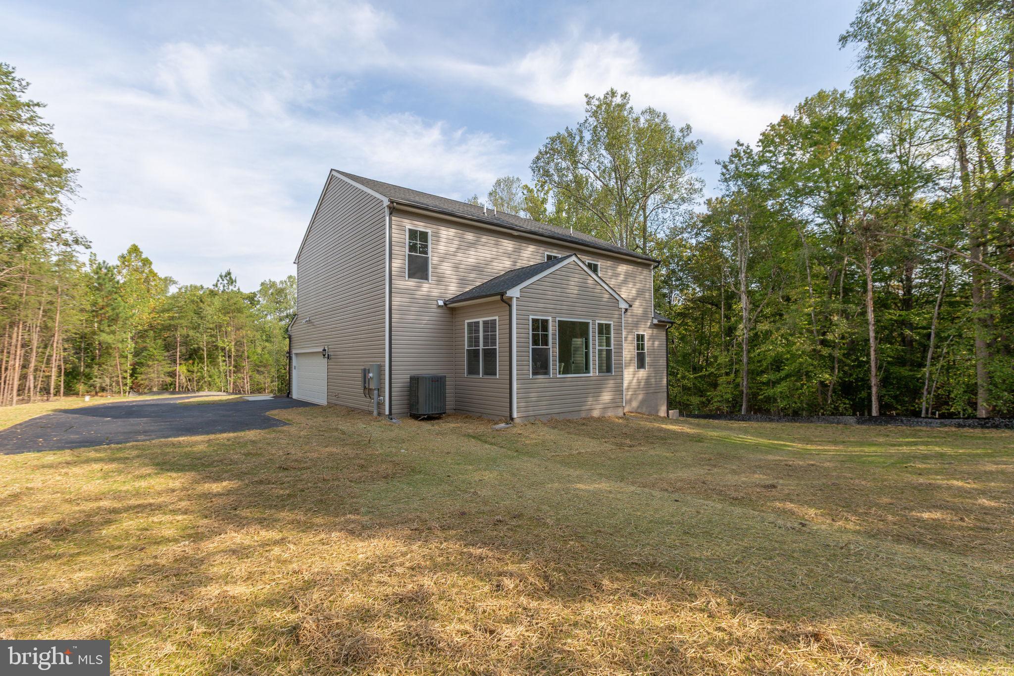 34198 Enchanted Way Locust Grove, VA 22508 - Photo 54 of 62 a view of a house with a yard and garage