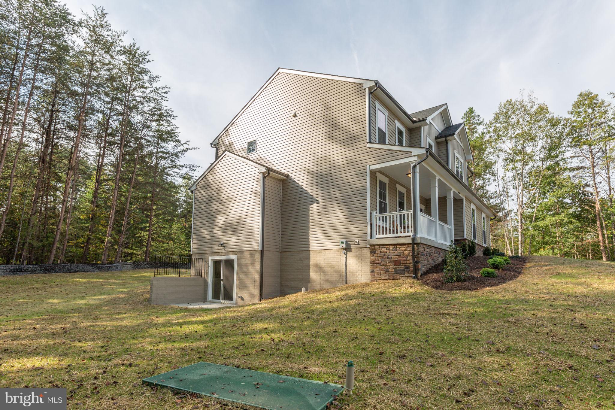 34198 Enchanted Way Locust Grove, VA 22508 - Photo 59 of 62 a view of a white house with a yard