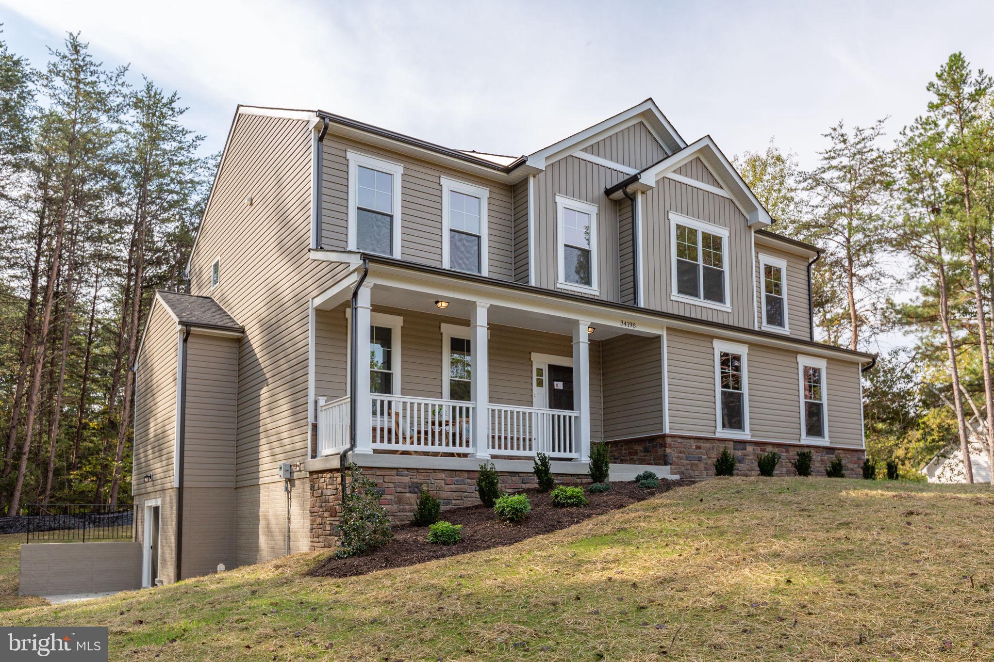 34198 Enchanted Way Locust Grove, VA 22508 - Photo 60 of 62 a front view of a house with a yard