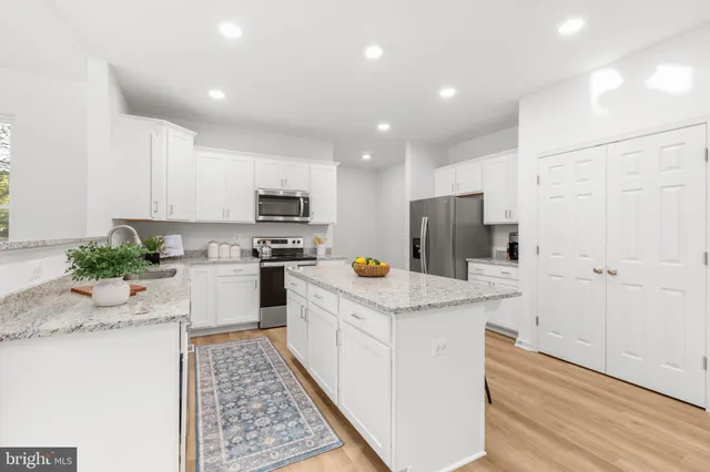 a view of a dining room with furniture and a wooden floor