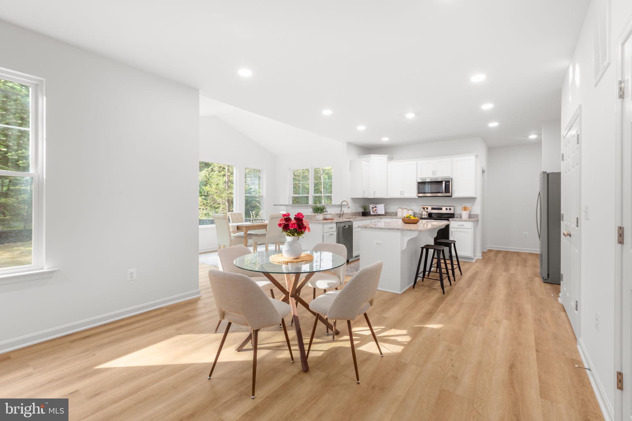34198 Enchanted Way Locust Grove, VA 22508 - Photo 9 of 62 a view of a dining room with furniture kitchen and wooden floor